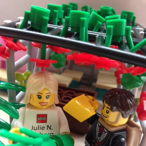Day 4 of Sukkot: LEGO representative Julie N. Broberg takes a break from ComicCon to shake the lulav while Hipster holds the etrog.