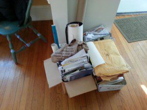 This pile includes three copies of my first novel manuscript, on its way to the shredder.