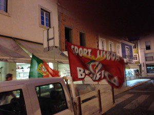 Flags and honking cars celebrate Benfica's clinching the national championship, the 34th in the club's history.